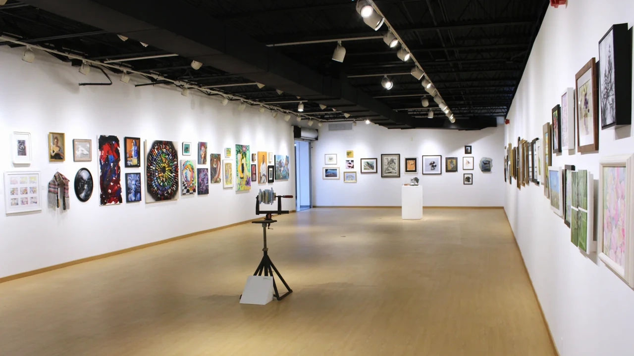 A bright gallery lined with framed artwork