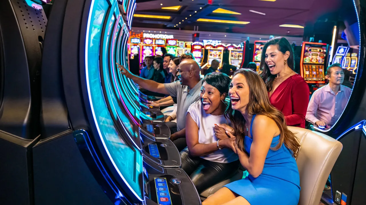 Friends cheer at a row of slot machines