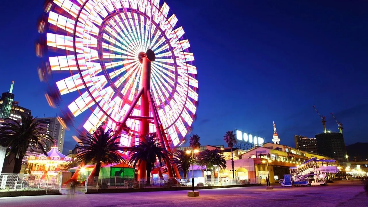 A lit Ferris wheel at night