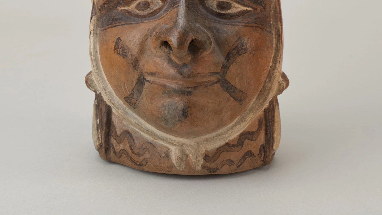 An ancient ceramic head vessel