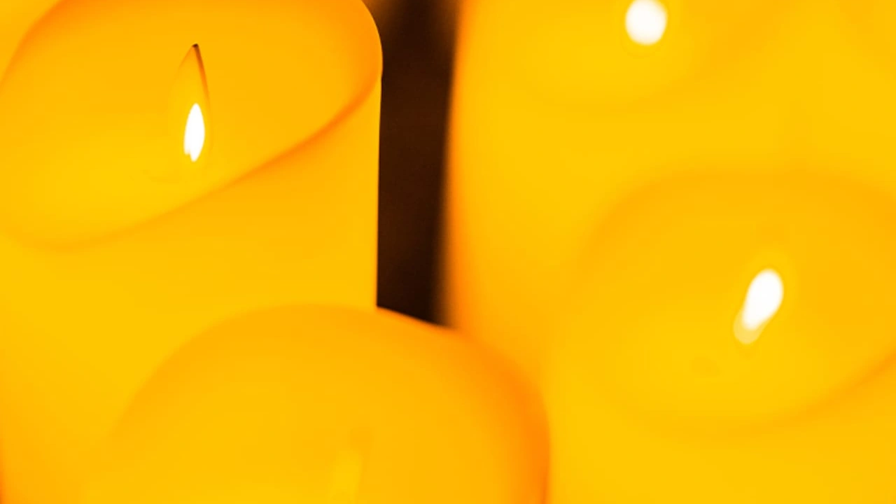 Candles glow in warm light