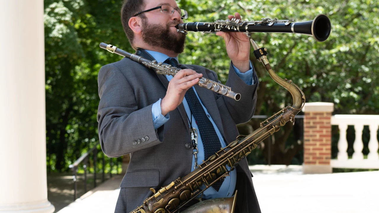 A musician plays saxophone and clarinet on a porch