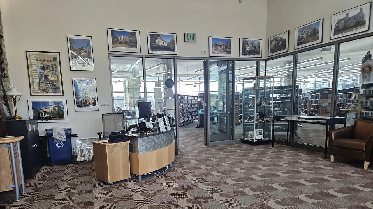 An archive reading room lined with framed photos