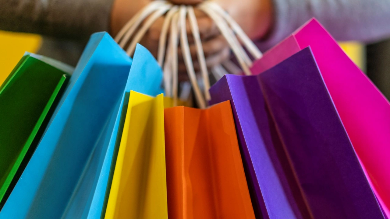 Colorful shopping bags held by a hand