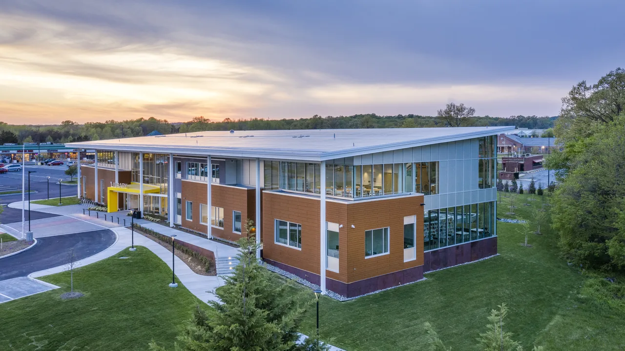 An aerial view of a modern school at sunset