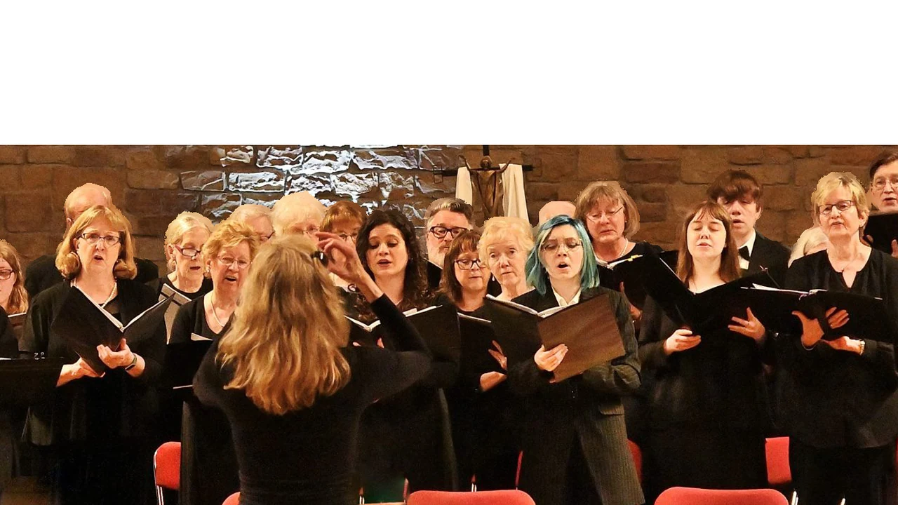 A choir sings in black robes