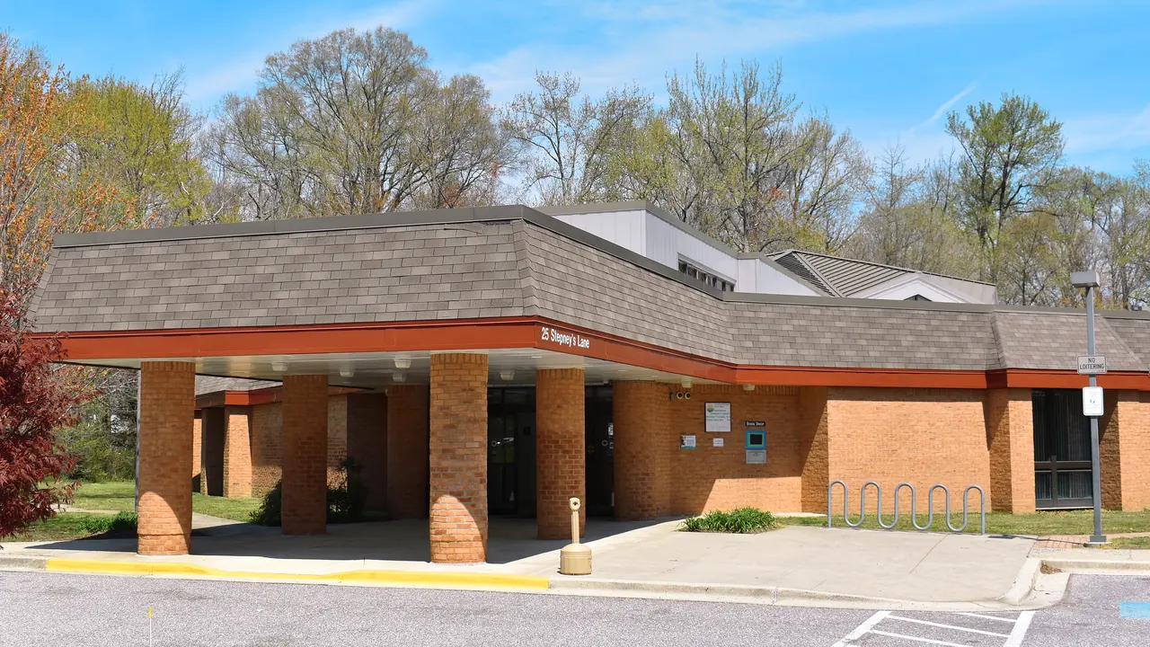 A low brick library building on a sunny day