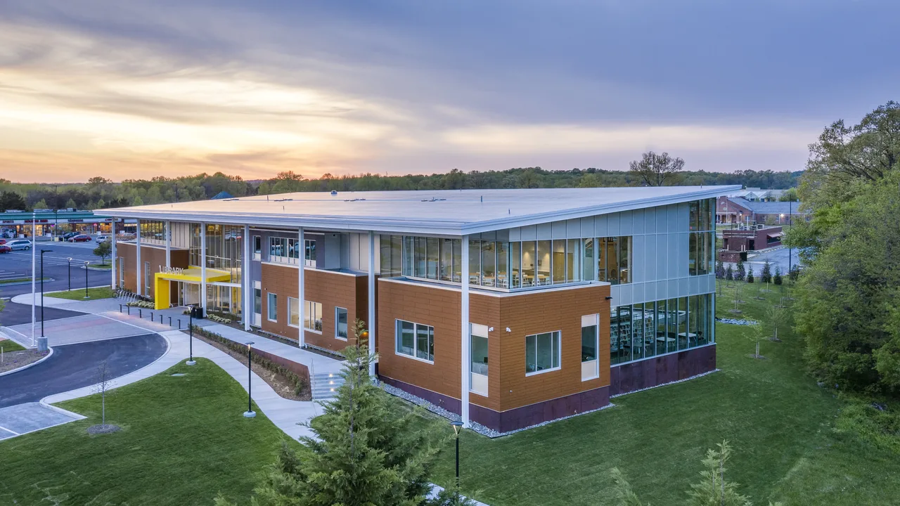 An aerial view of a modern school at sunset