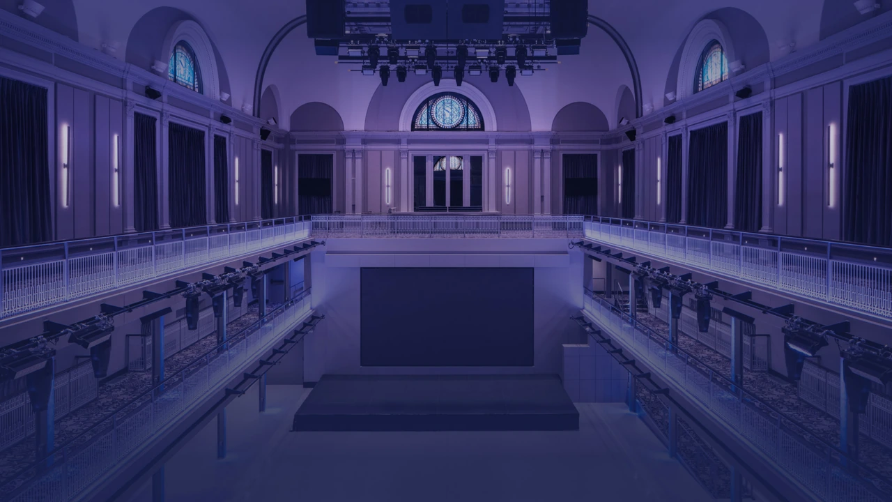A grand hall bathed in purple light