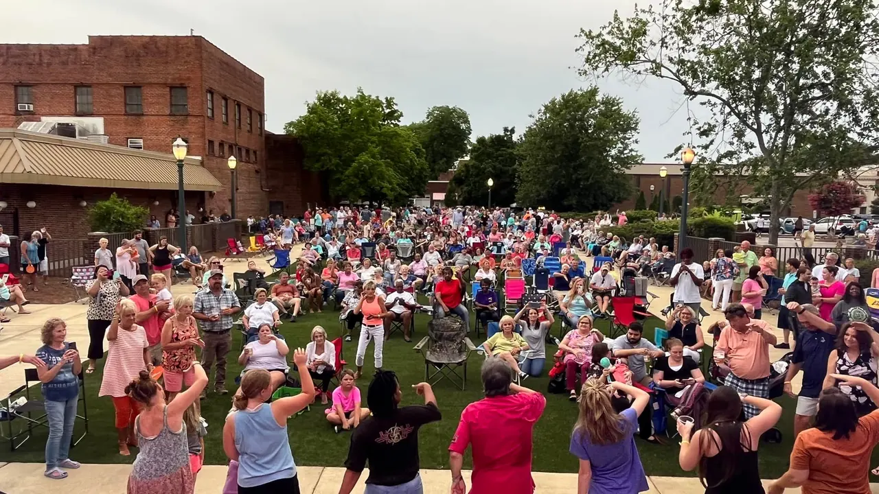 A crowd gathers on the lawn in downtown Tarboro