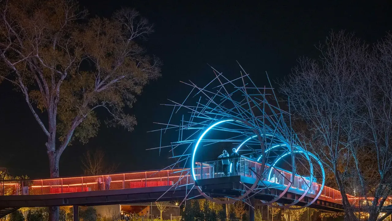 The lit Downtown Cary Park skywalk at night