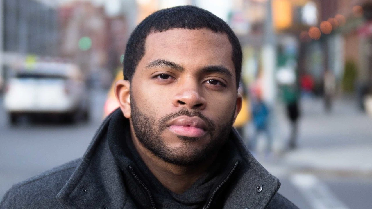 A portrait of a young man on a city street