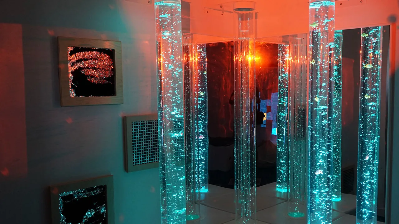 Glowing bubble tubes in a dim sensory room
