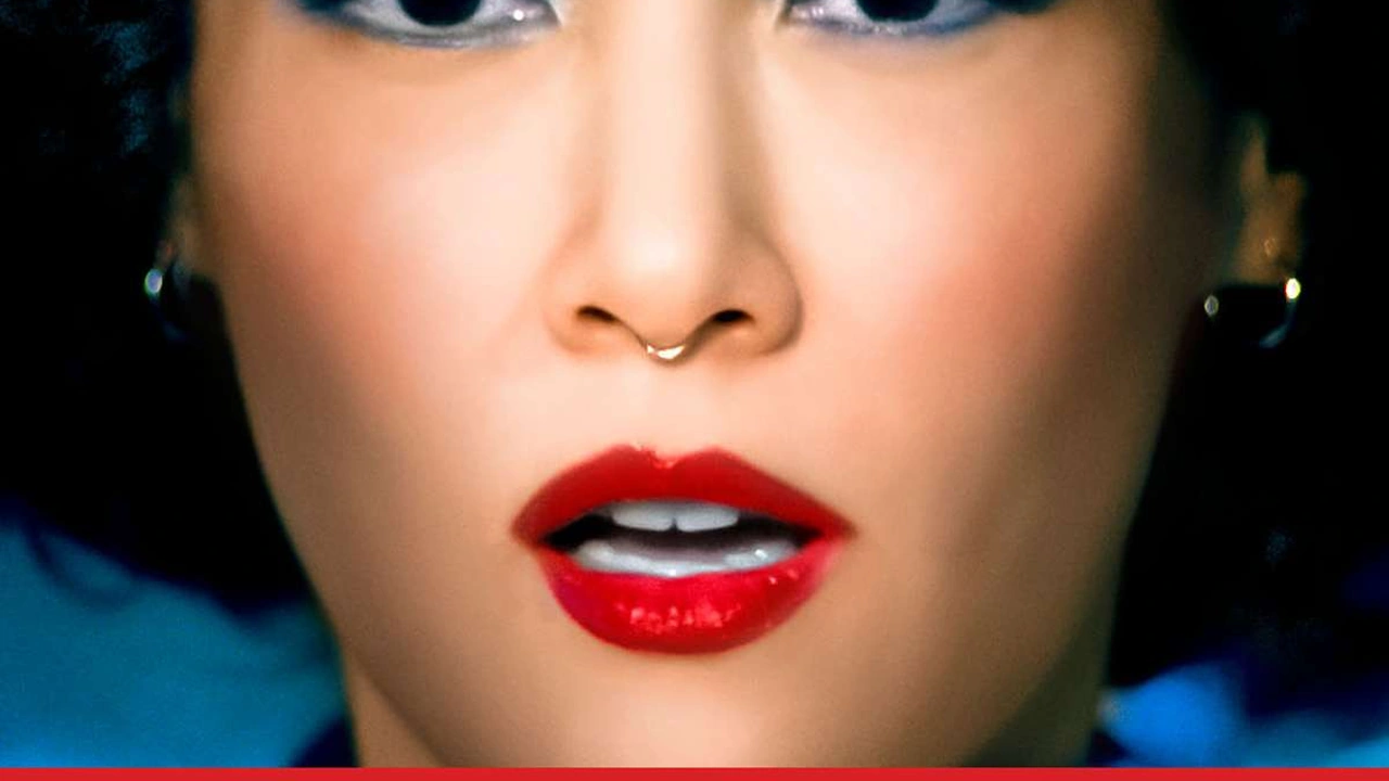 Close-up of a woman with red lipstick and a nose ring