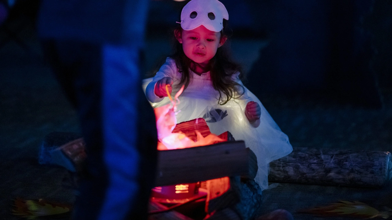 A child in a glowing costume at a Halloween party