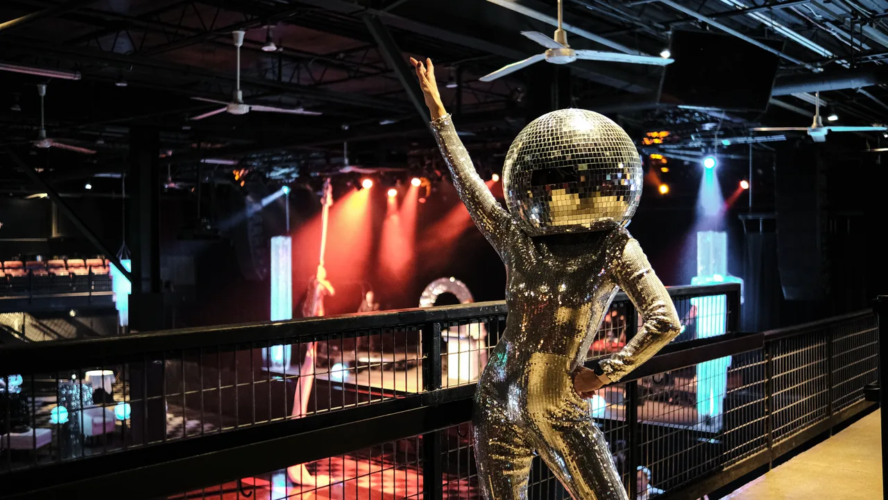 A silver astronaut statue inside The Ritz concert hall