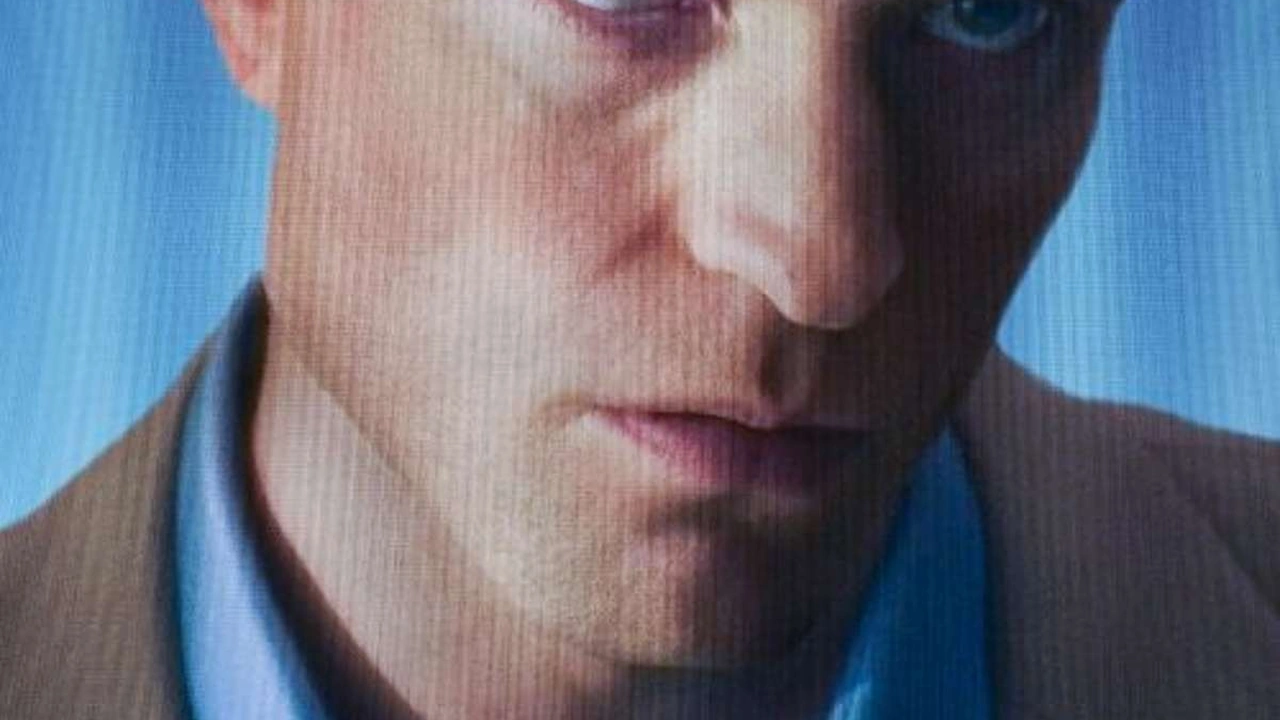 A close-up of a man's face in blue light