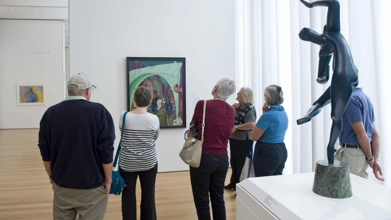 Visitors view sculpture in a bright gallery