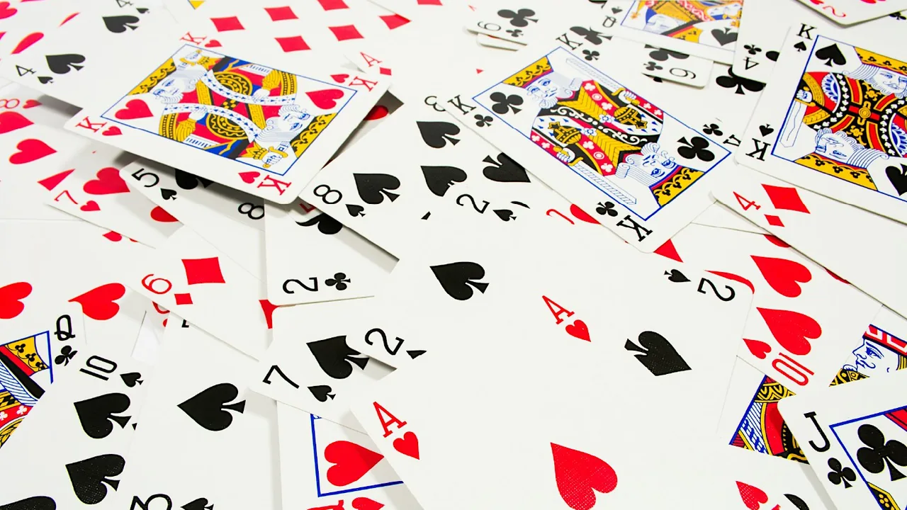 Playing cards spread across a table