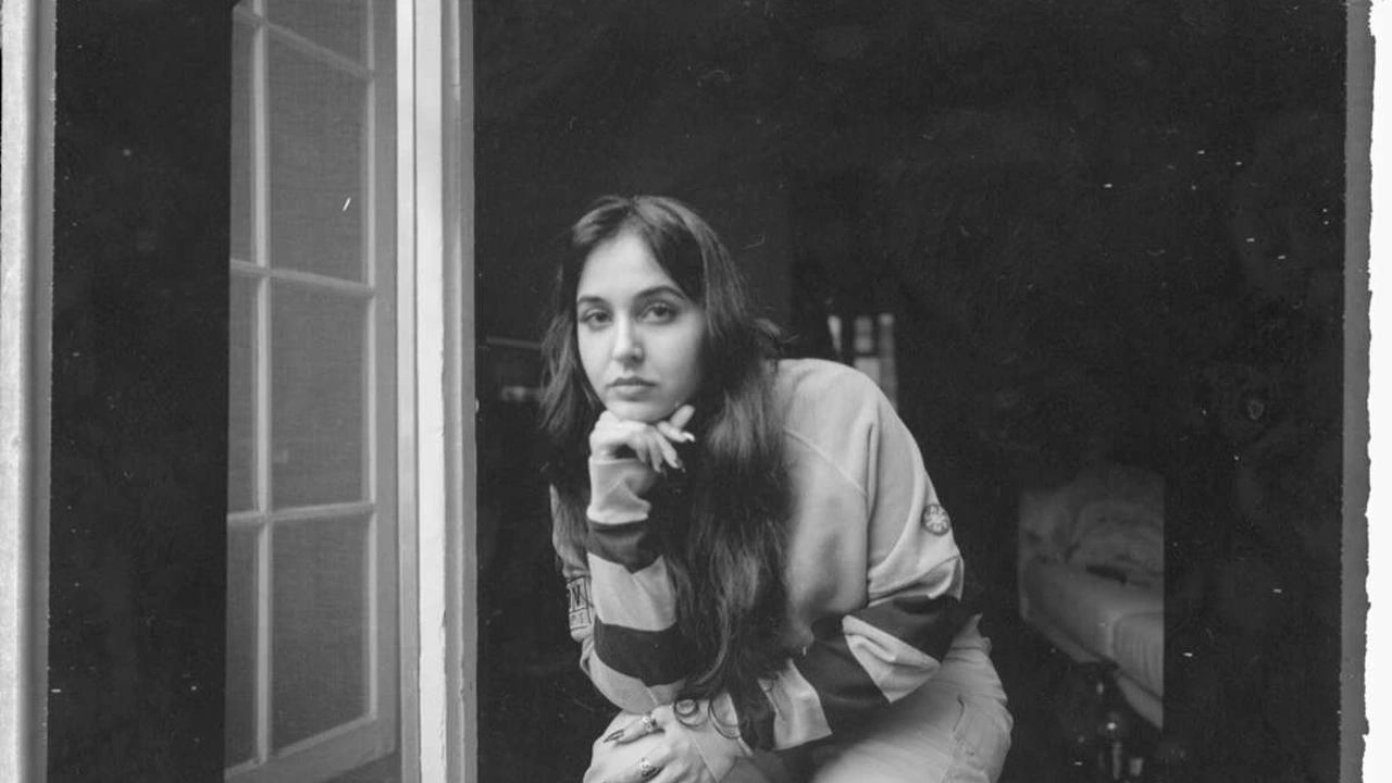 A black-and-white portrait of singer Yana