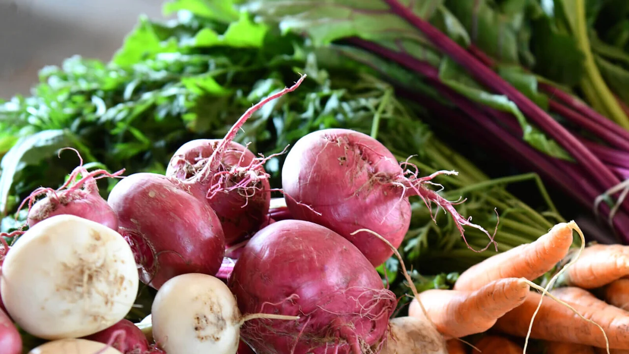 Fresh beets, carrots and greens at a market