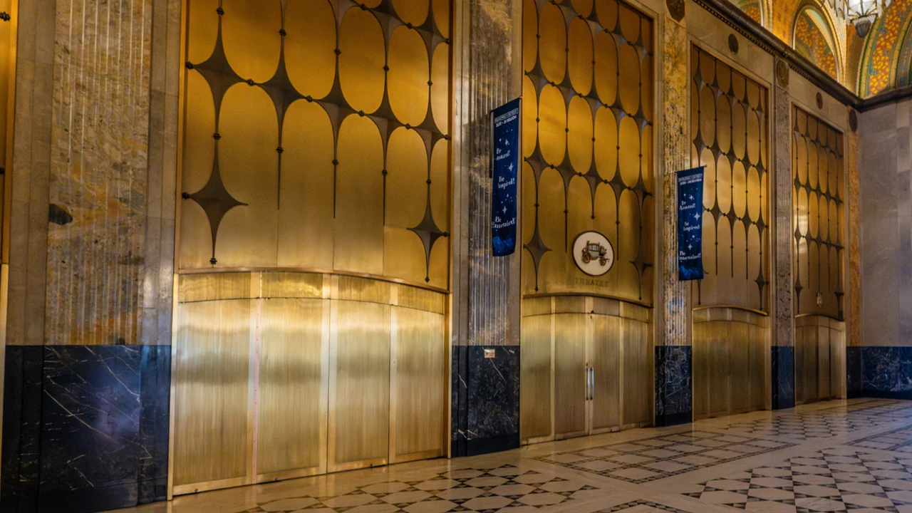 A gleaming gold Art Deco elevator lobby