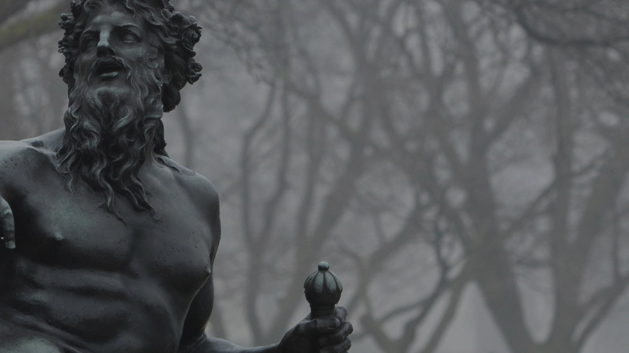 A weathered bronze statue in winter fog