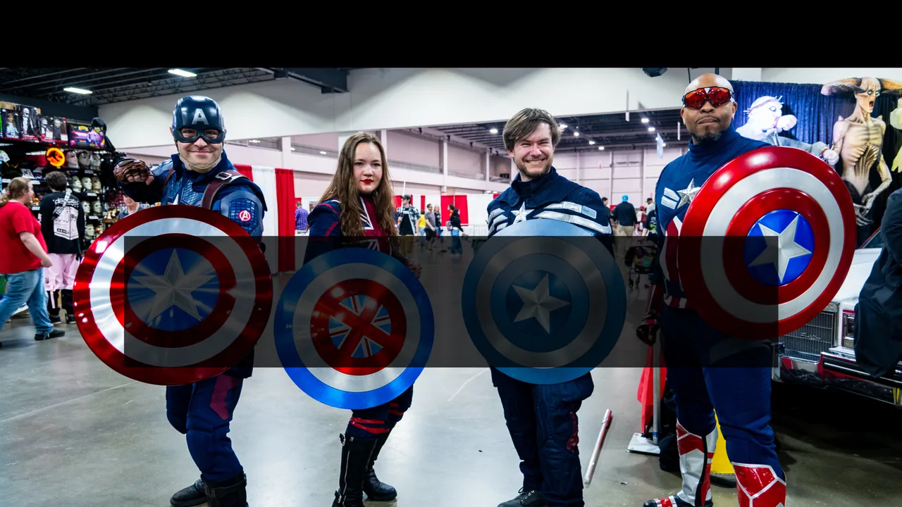 Fans dressed as Captain America pose with shields at a convention