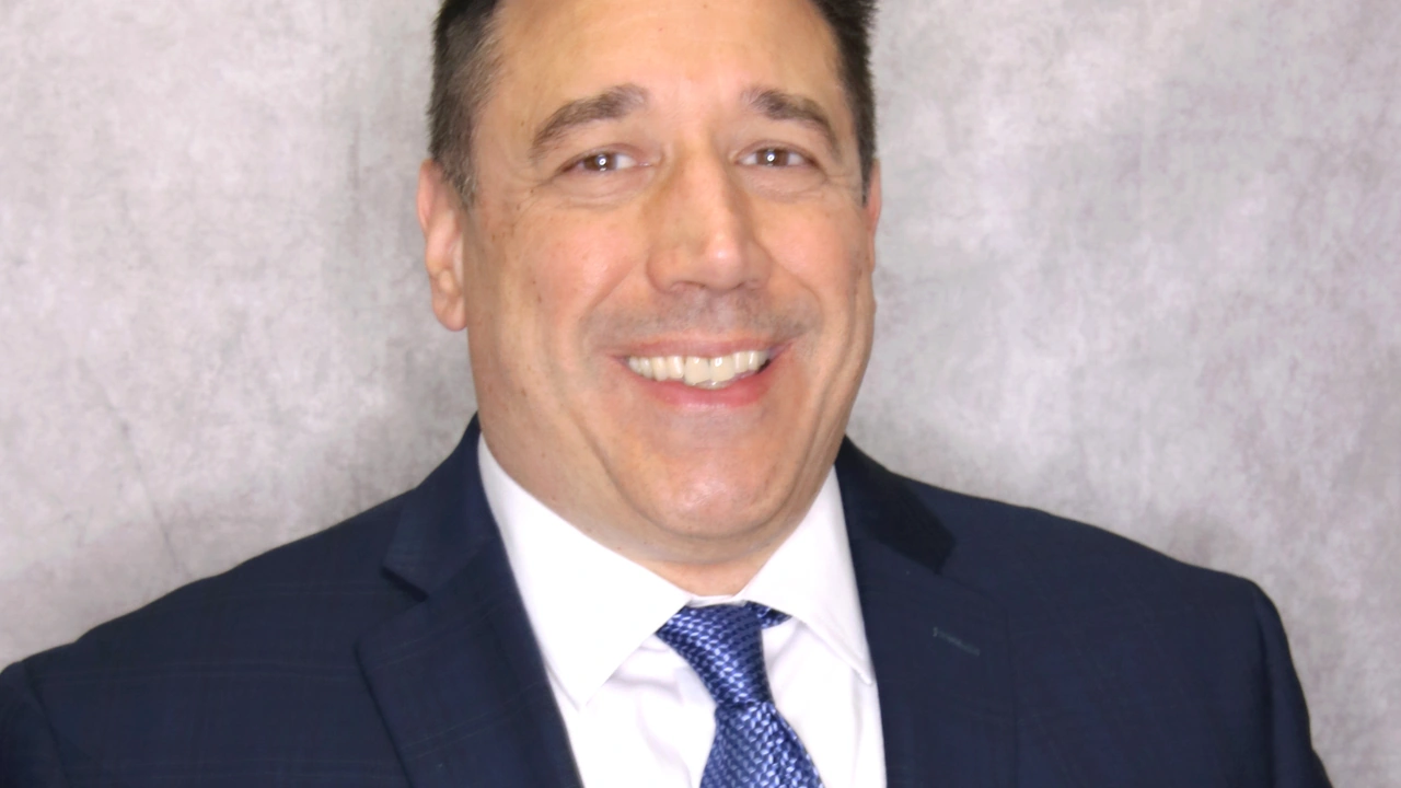 Portrait of a smiling man in a suit and tie