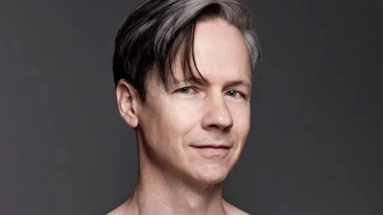 Portrait of a man with swept-back hair