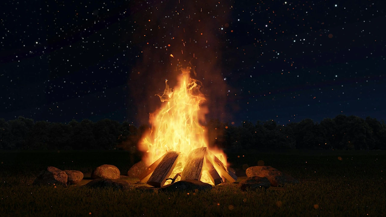 A campfire burns under a starry night sky