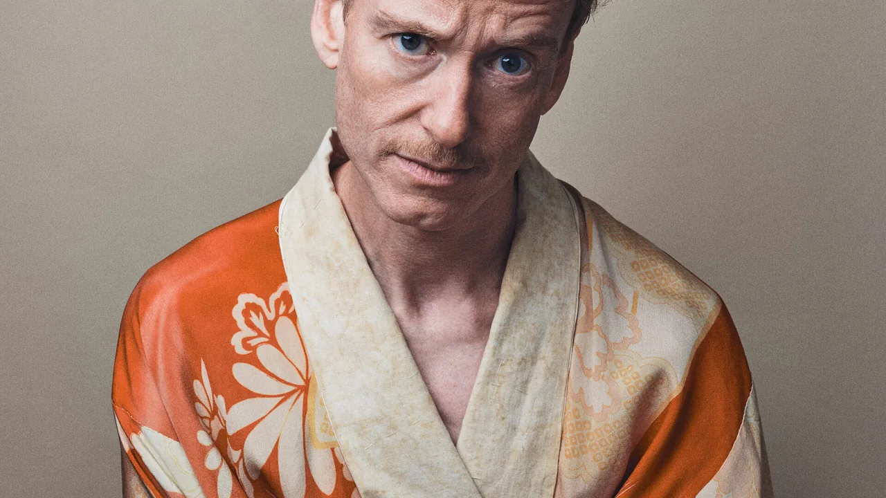 A man in a patterned kimono-style robe gazes at the camera