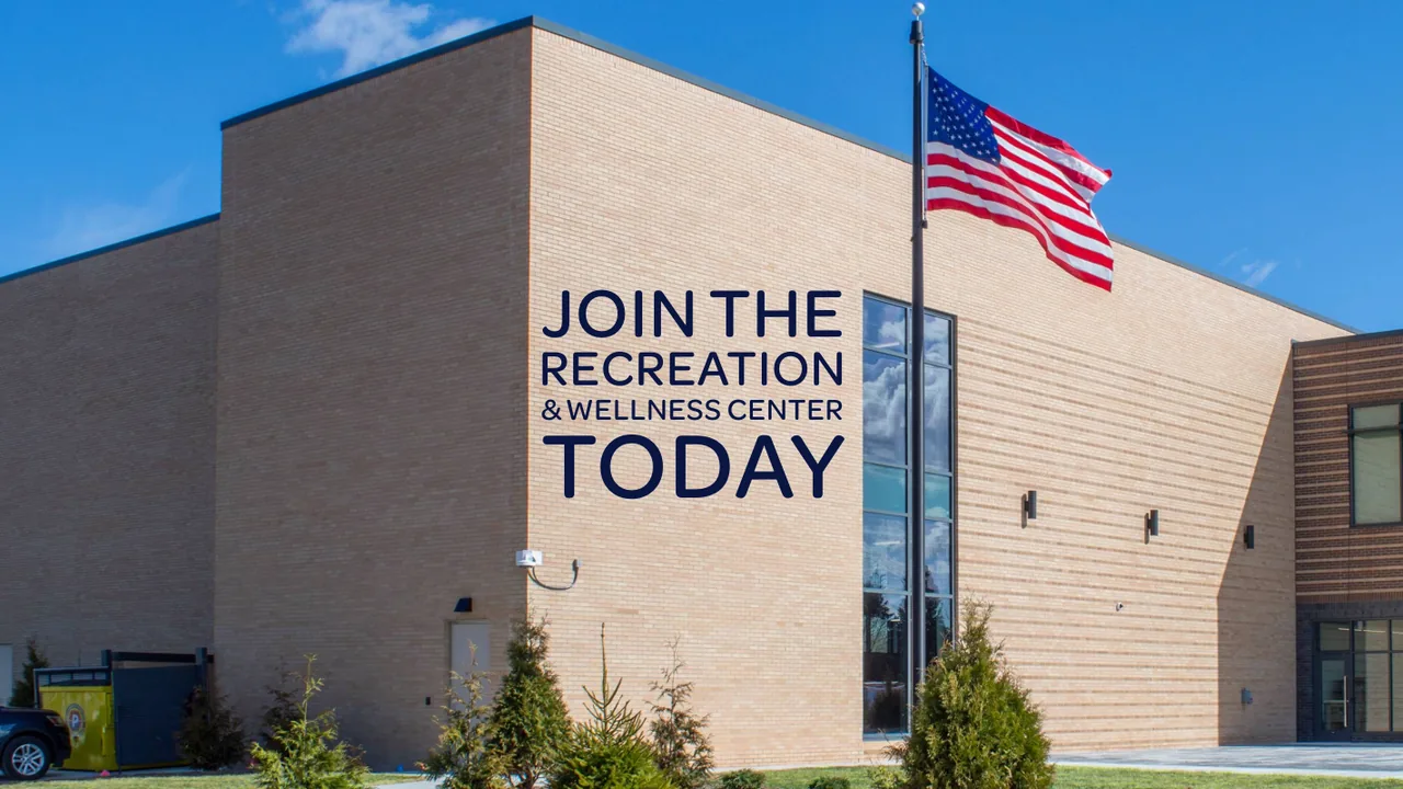 Exterior of the Redford recreation and wellness center with an American flag